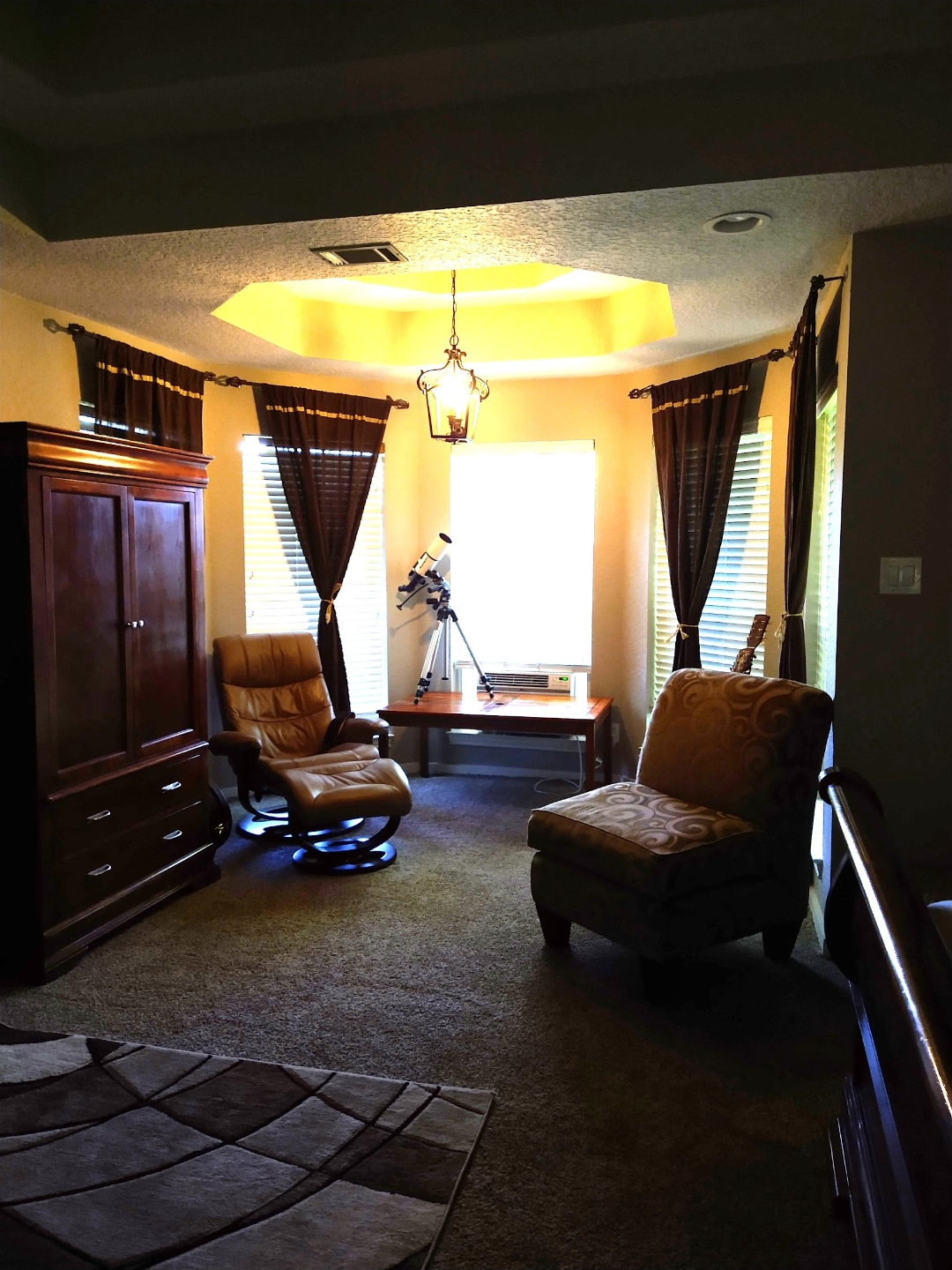 Tidied sitting room with vacuumed carpet and dusted surfaces